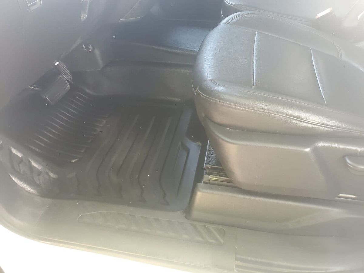 Driver seat and floor cleaned to like-new condition after interior detailing in the Greater Toronto Area